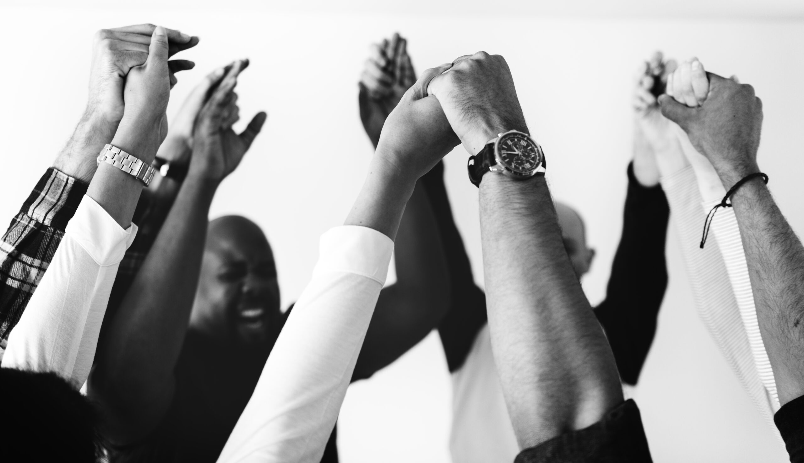 Men joining hands in brotherhood
